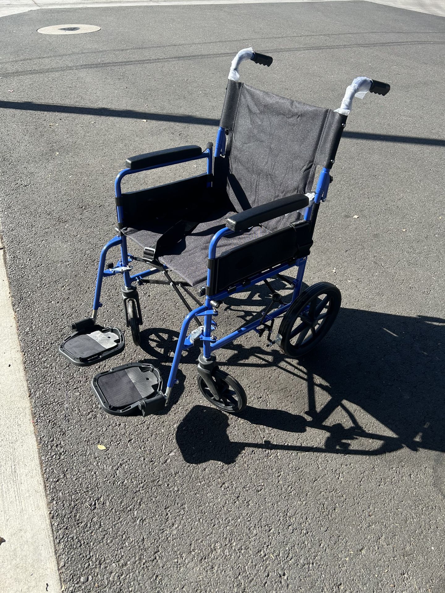 Brand New Light Weight Folding Wheel Chair For $90 