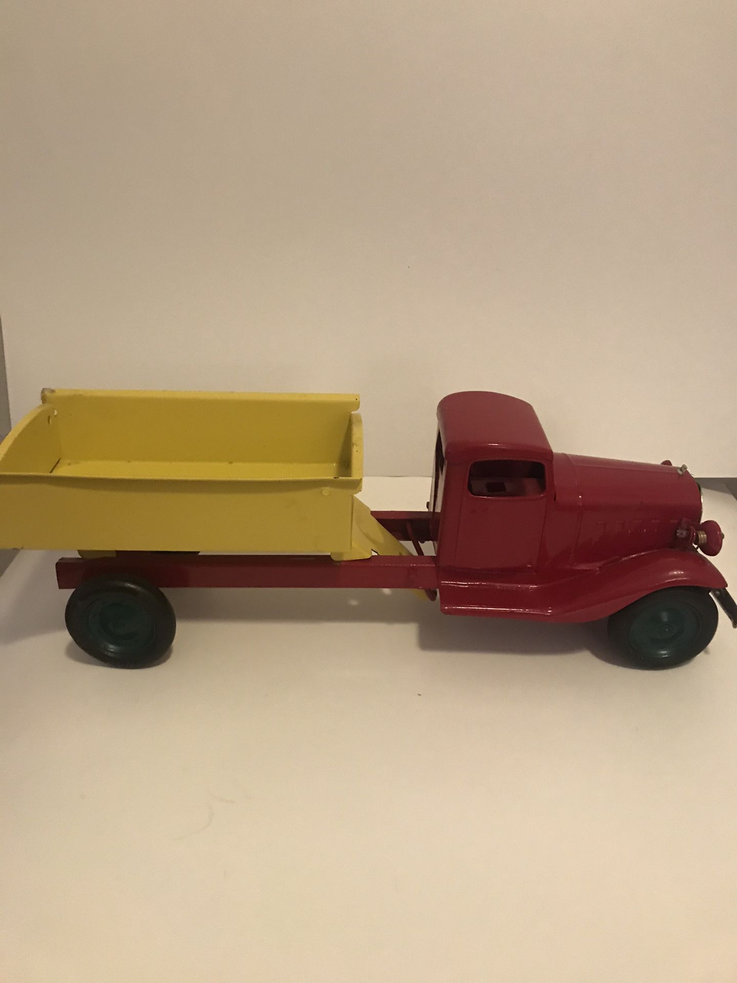 Vintage and Rare Turner Toys Pressed Metal Red and Yellow Dump Truck with Battery Slot for Working Headlights 18in Length 6in Height Normal Wear Rubb
