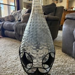 27” Hand-blown glass vase with metal stand. $20