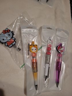 Hello Kitty Pens and Kitty Badge Reel