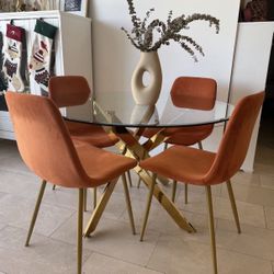 Modern 47" Round Glass Dining Table with Sculptural Metal Base In Gold