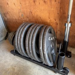 OLYMPIC WEIGHT PLATES W/ BAR & STORAGE