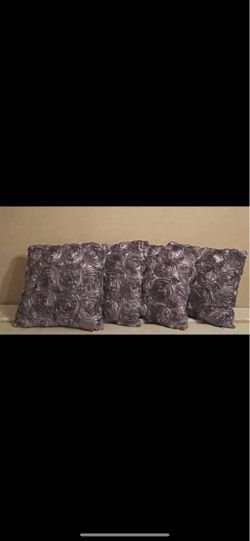 Four decorative pillows