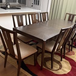 Used Wooden Dining Table and 8 Chairs in Working and Like New Condition 