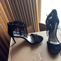 Black suede heels with tassels
