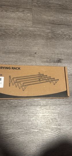 Wall mounted clothes drying rack