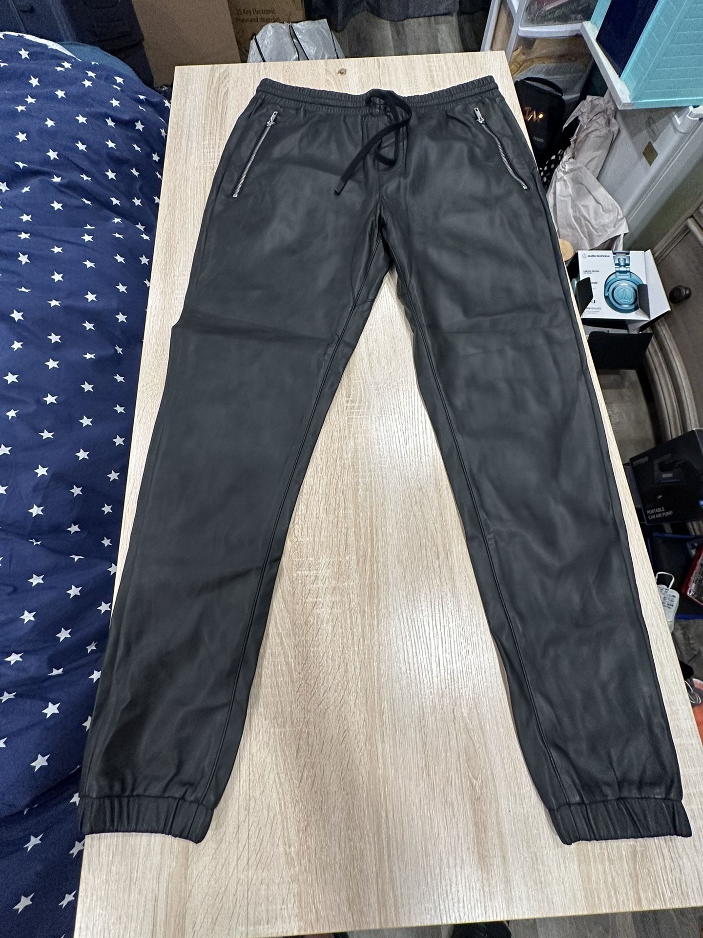 Black faux leather joggers