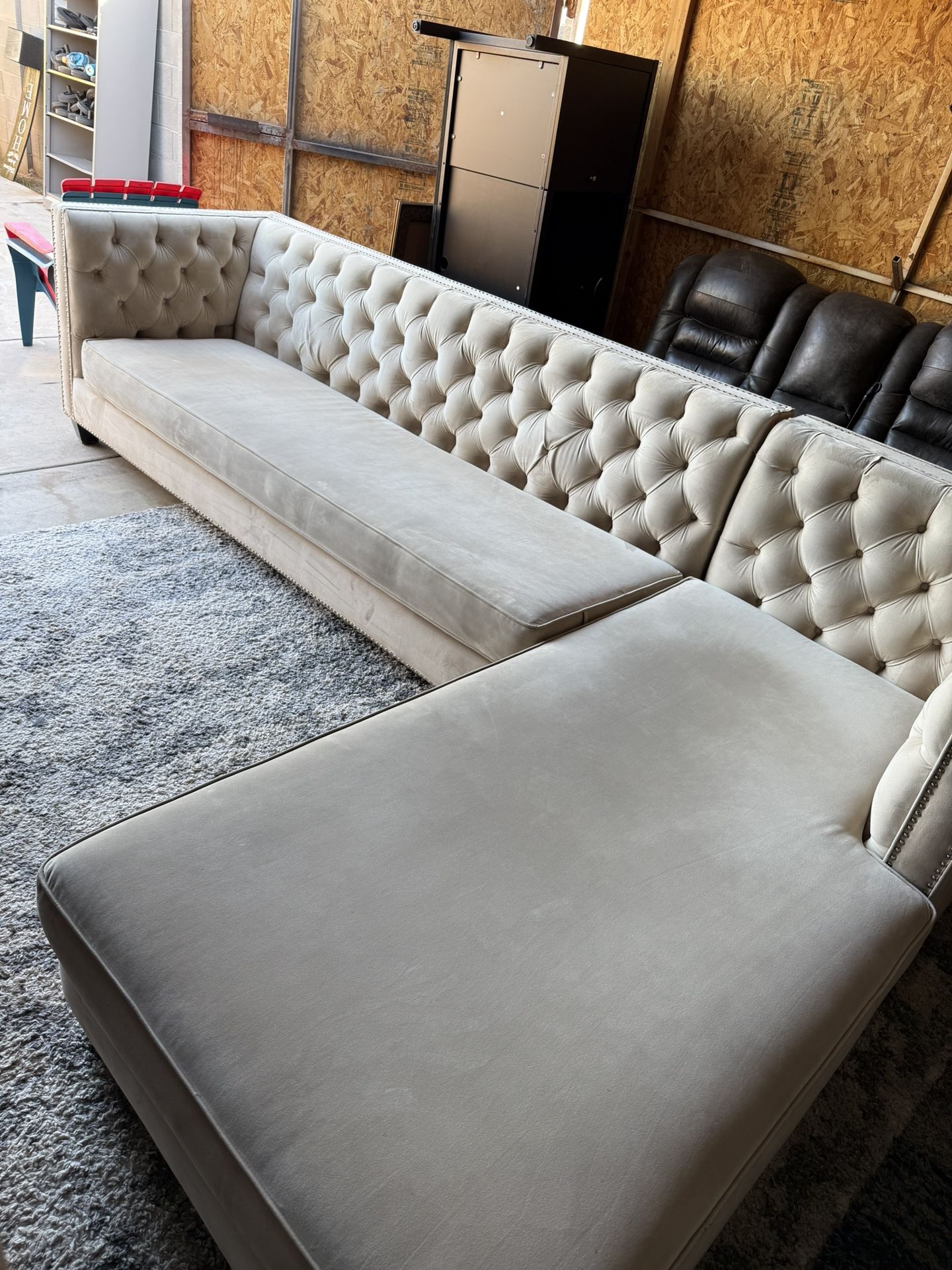 tufted, L-shaped sectional sofa with a chaise lounge. *champagne color* 
