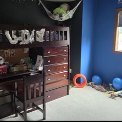Loft bed with desk, dresser, storage/closet and trendle (2nd) bed.