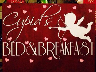 Rustic wood Cupid sign