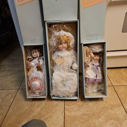 MUSICAL PORCELAIN DOLLS  MUST SELL