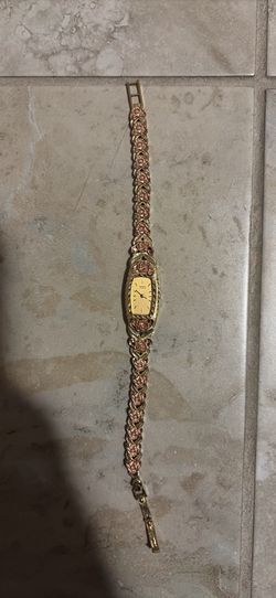 10k solid gold stamped on band watch the back is stainless steel