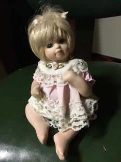 Tiny porcelain doll
