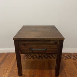 Dark wood small table with drawer it’s a little scuffed 