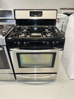 Frigidaire stainless steel natural gas stove; includes a receipt for a 90-day warranty.