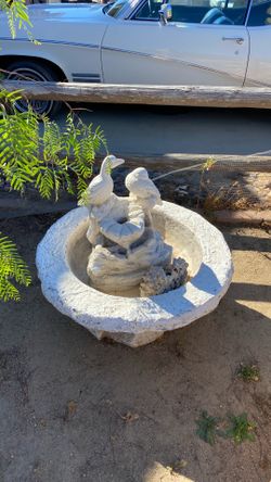 Cement fountain with birds