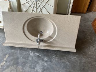 Vanity top with sink and faucets