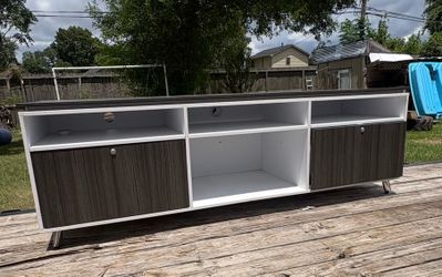 TV entertainment center with locking doors