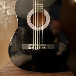 Black acoustic guitar 