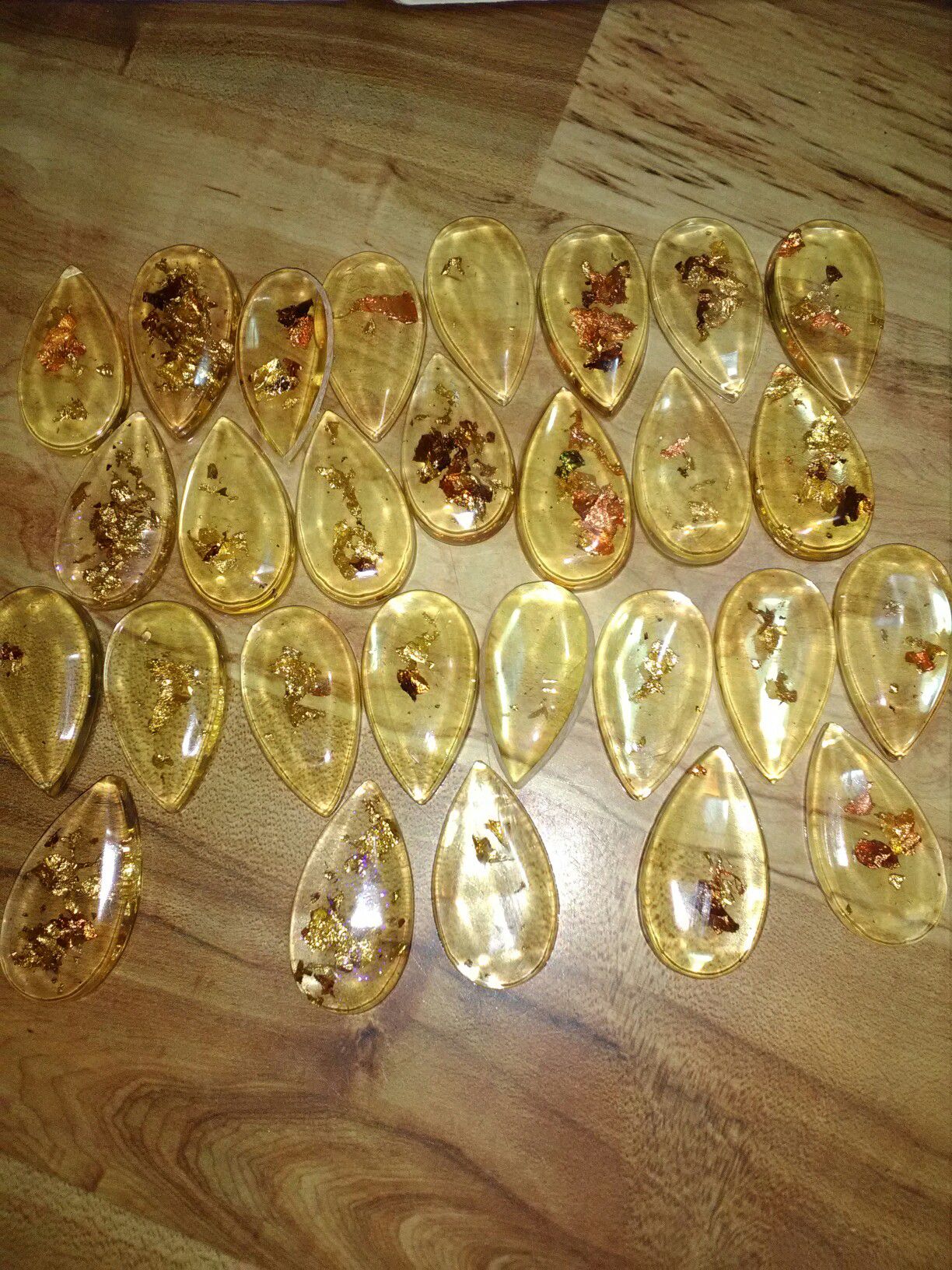 Gold flakes in plastic teardrops .Best offer accepted