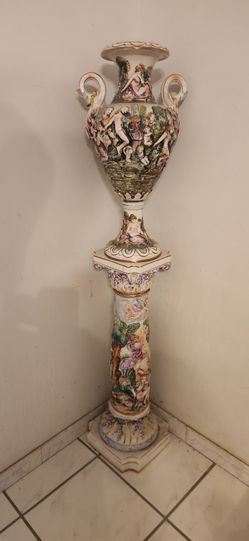 Italian Capodimonte-style porcelain urn with a matching pedestal