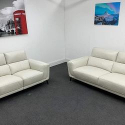 Power Reclining Leather Sofa and Loveseat Black and White Antonio