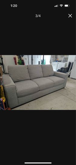 Gray fabric 3-seat sofa from Living Spaces.