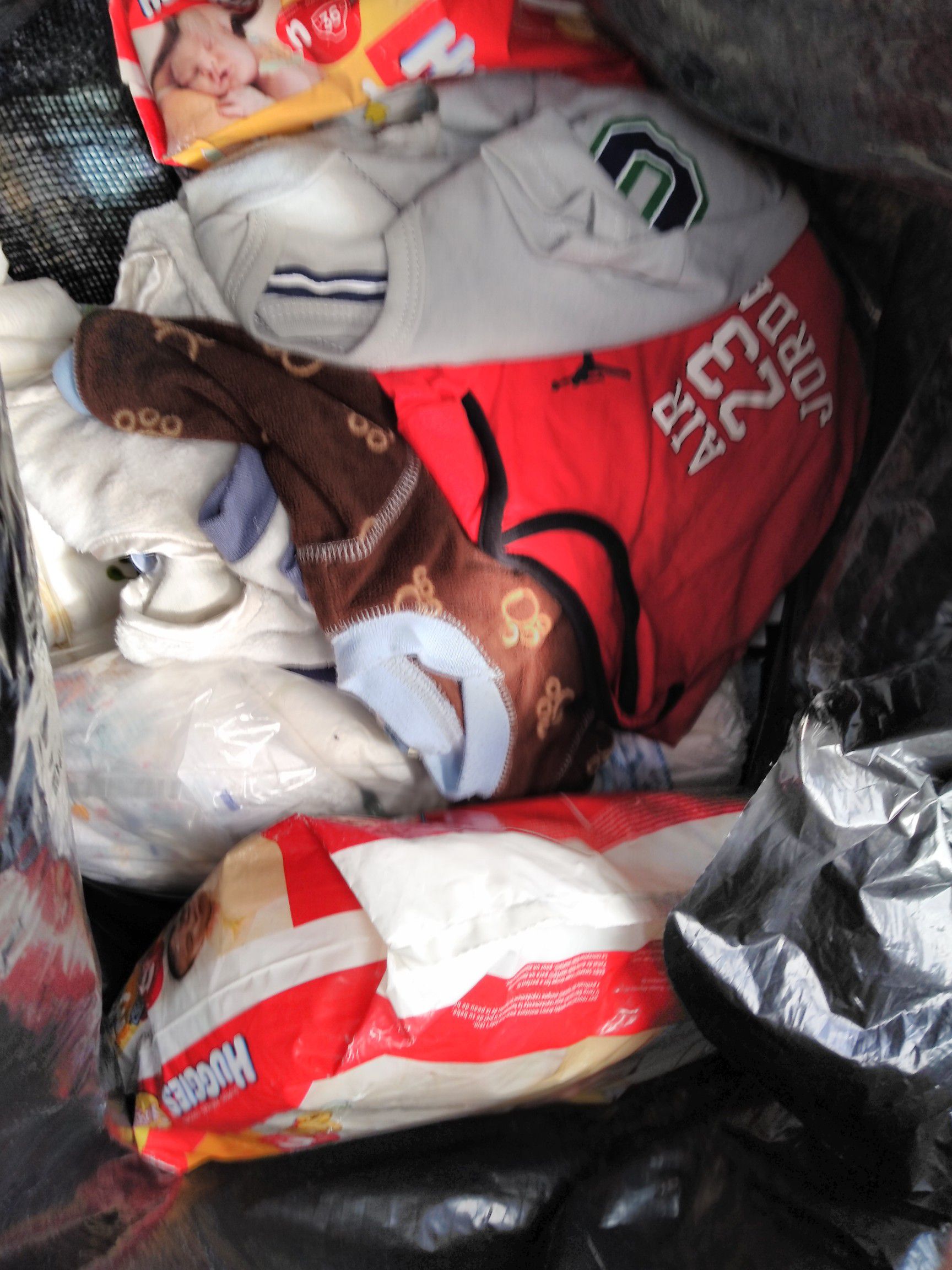 FREE BAG OF NB BABY CLOTHES & DIAPERS OUTSIDE