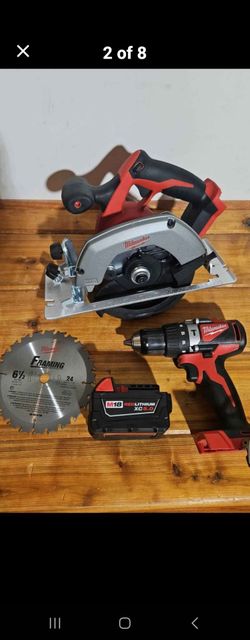 Milwaukee M18 6 1/2" circular saw, hammer drill, battery.