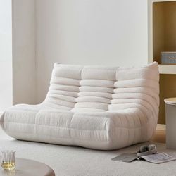 Brand new modern lounge sofa in bouclé fabric. Very comfortable, stylish and perfect for apartments, studios or living rooms. Never used, in excellent