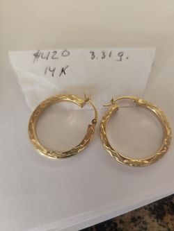 Elevate your everyday look with these stunning 14K solid yellow gold hoop earrings. Featuring an intricate diamond-cut pattern, these hoops catch the 