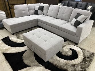 Grey sectional with ottoman