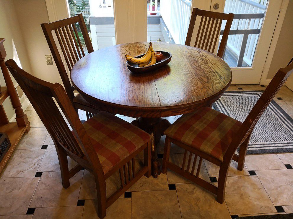Solid oak round kitchen dining table and chairs