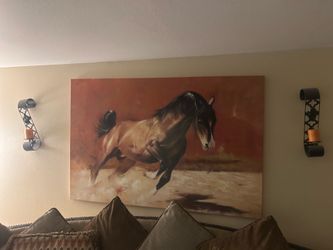 wall art and two candle holders