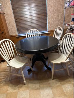 Round dining table with six Windsor chairs