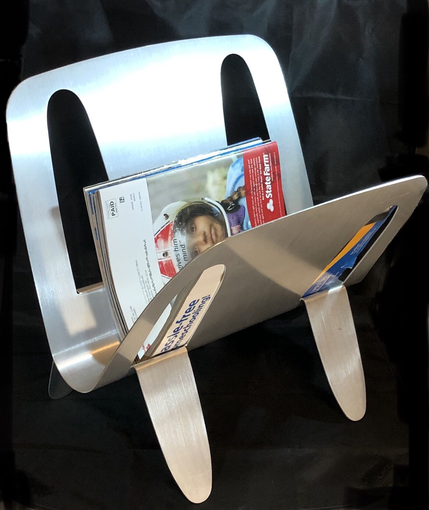 Umbra Magazine Stand - Modern Contemporary Brushed Aluminum Magazine Stand - Umbra, by Designer William Harvey