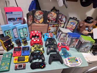Selling All these games and controllers,  everything for 220. Everything in Good condition. 

11 small electronic games...

-red Vintage MGA Super aut