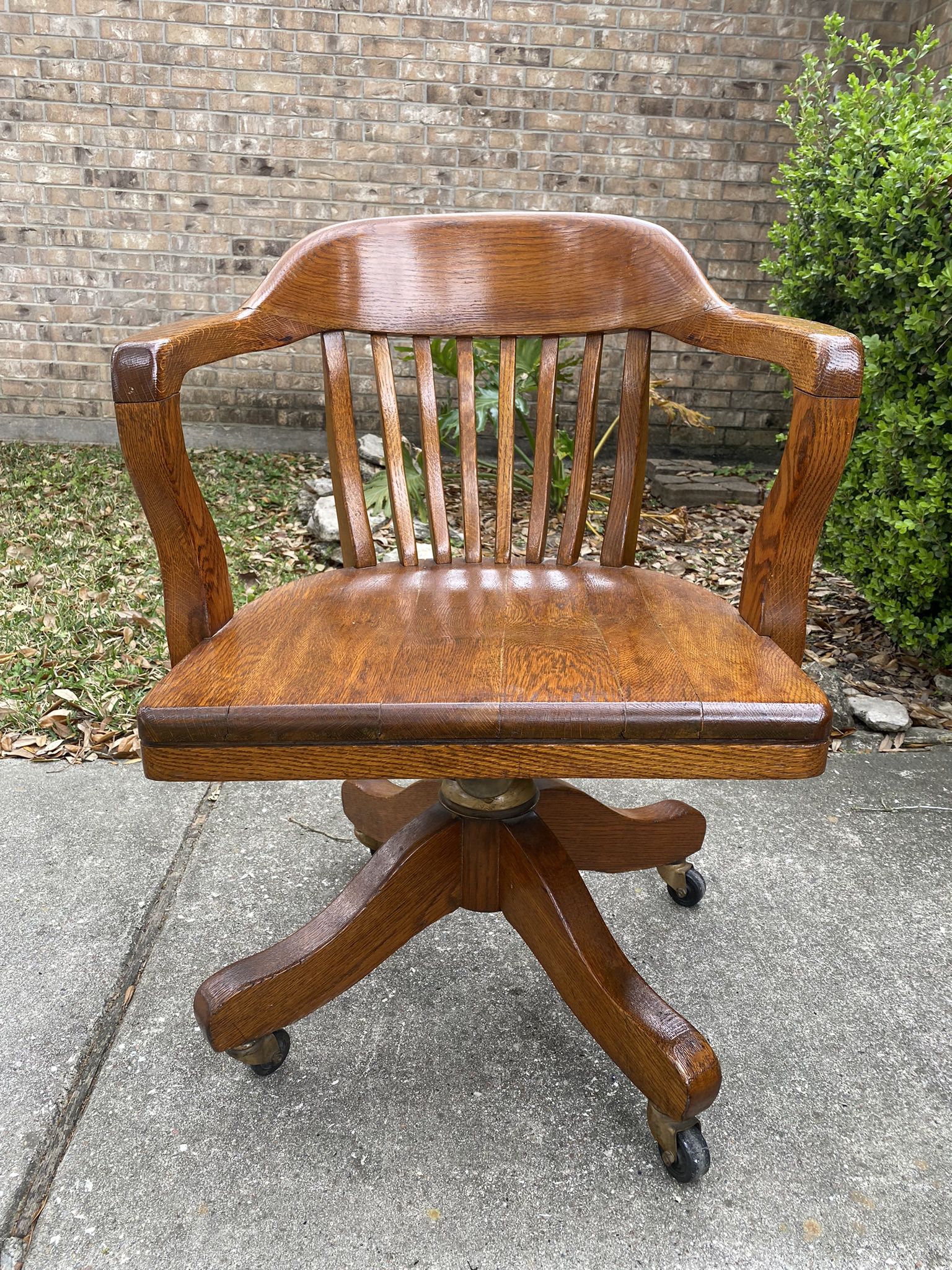 Solid oak desk chair on wheels