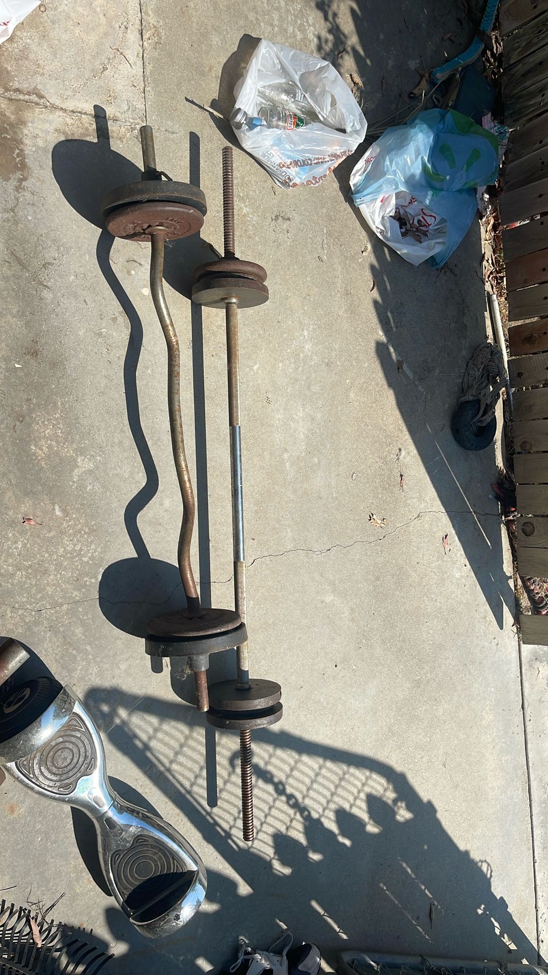 Two Exercise Bars With Some Weights