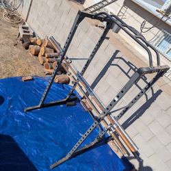 Squat Rack, Barbells, And Weight Plates
