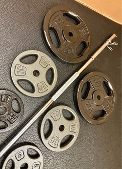 Standard Steel 6 ft Brand New Bar with pair of Cast Iron Plates of 25#, 10# , 5# and 2.5 pounders. Brute Weight: 105#