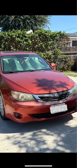 2009 Red Subaru Impreza