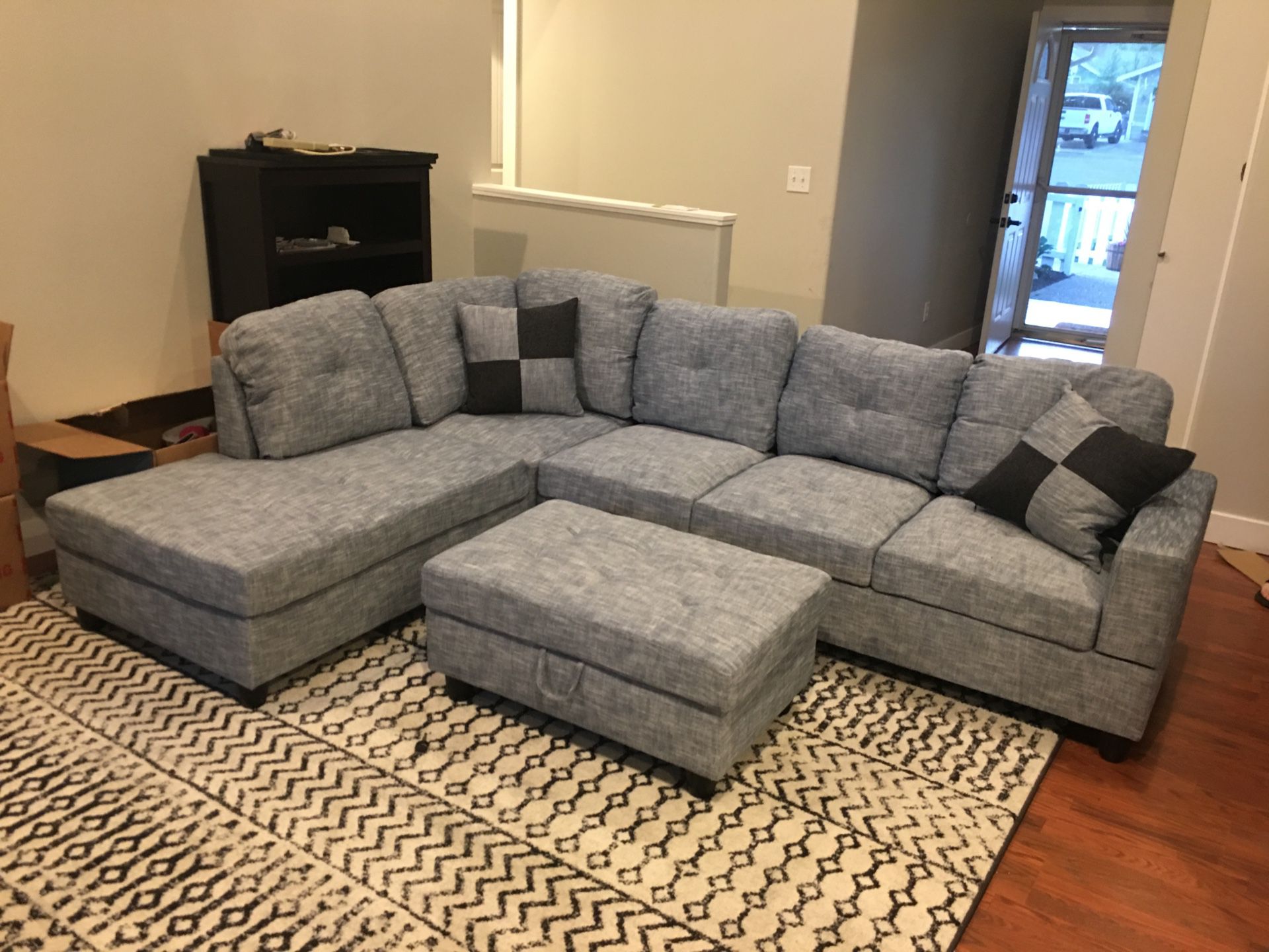 New gray linen sectional couch with storage ottoman