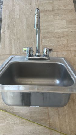 Still Sink , With water Faucets.