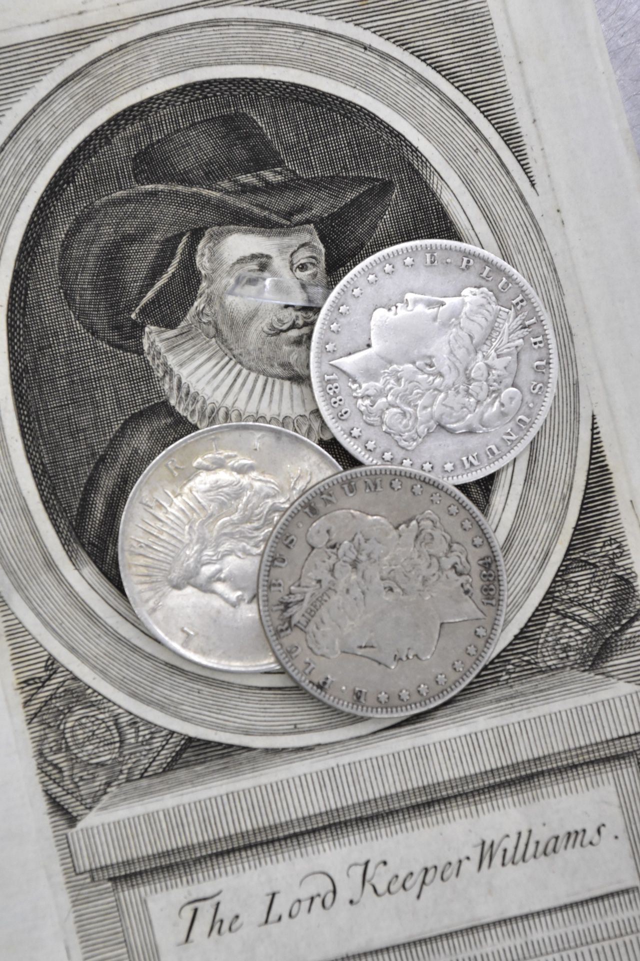 3 silver dollars: 2 Morgan, 1 Peace