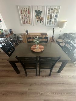 Dining room brown wooden table with 6 chairs