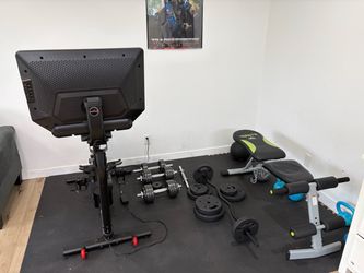 Home gym Bowflex Bike + dumb bell curling bar