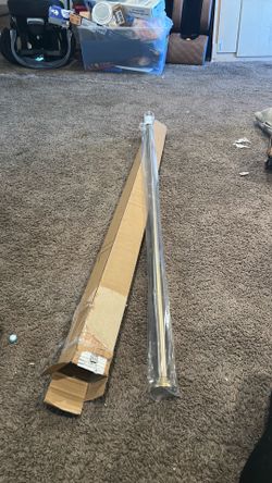 Brass colored window or shower curtain tensioning rod