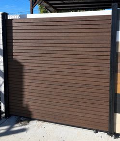 Innovative Dark Brown Slat Composite Fence