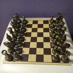 CHESS SET, CHESS BOARD, HEAVY METAL PIECES, BOARD IS 12X 12, PIECES ARE BETWEEN 2 in, 3 in AND 4 in TALL